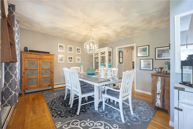 545 Central St, Burrillville, RI 02839 - dining room featuring a chandelier and wood finished floors