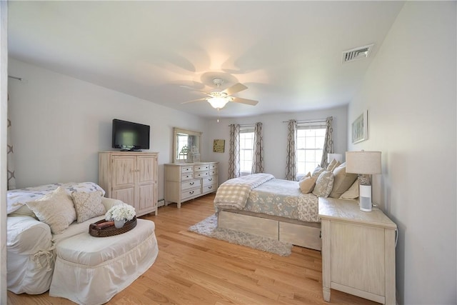 545 Central St, Burrillville, RI 02839 - bedroom with multiple windows, light wood finished floors, a baseboard heating unit, and a ceiling fan