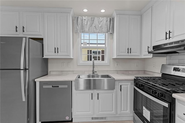 548 Kenyon Ave, Attleboro, MA 02703 - kitchen with a sink, white cabinets, stainless steel appliances, and visible vents