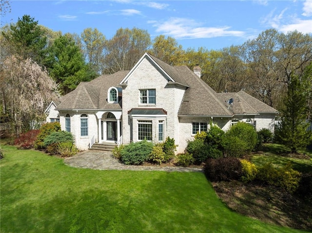 4 Christopher Dr, Lincoln, RI 02865 - exterior space with a chimney, brick siding, and a front yard