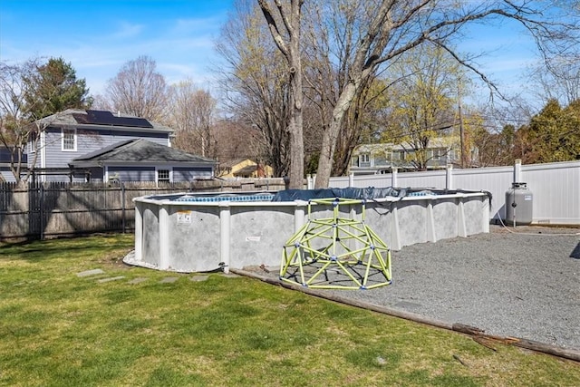 view of yard featuring a fenced in pool and a fenced backyard