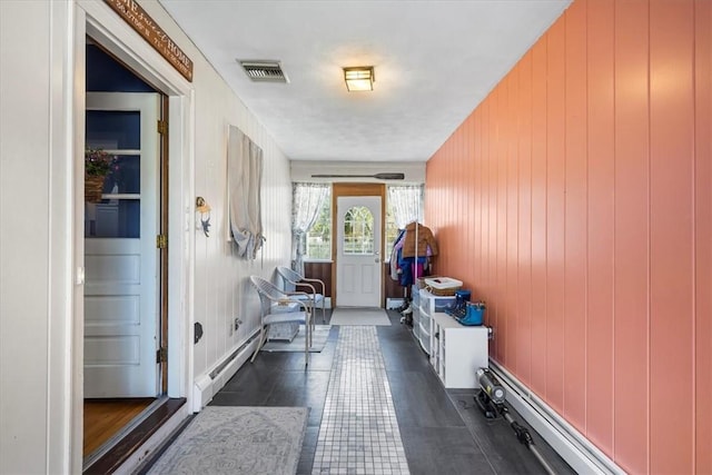 mudroom with visible vents and baseboard heating