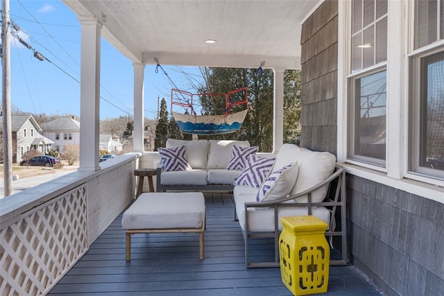 wooden terrace with outdoor lounge area