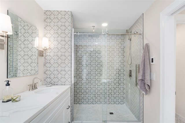 bathroom featuring vanity and a stall shower