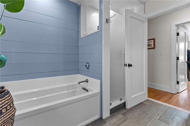 386 Stone Church Rd, Tiverton, RI 02878 - bathroom featuring a garden tub, wood finished floors, a shower, and baseboards