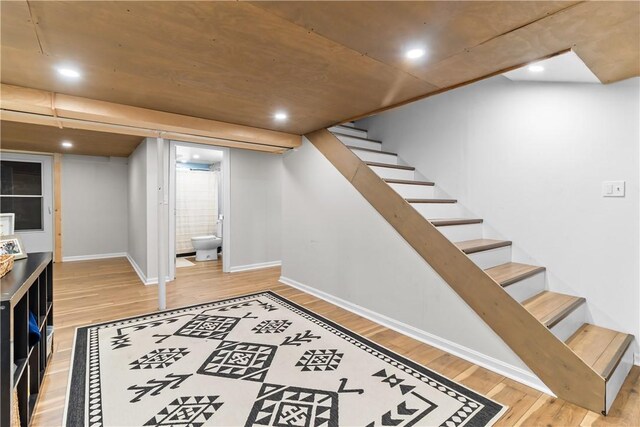 386 Stone Church Rd, Tiverton, RI 02878 - finished basement featuring light wood-type flooring, stairs, baseboards, and recessed lighting