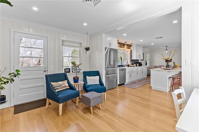 386 Stone Church Rd, Tiverton, RI 02878 - sitting room featuring ornamental molding, light wood-style floors, and recessed lighting
