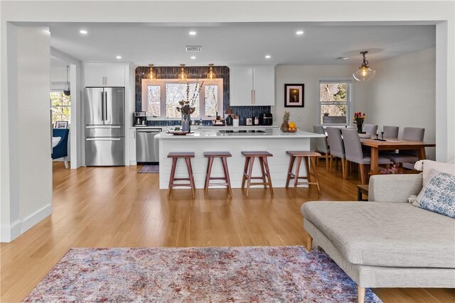386 Stone Church Rd, Tiverton, RI 02878 - living area with light wood-style flooring and recessed lighting