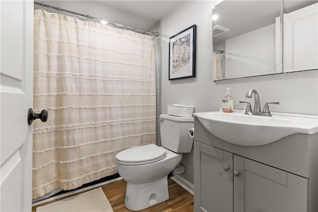 386 Stone Church Rd, Tiverton, RI 02878 - full bath featuring wood finished floors, toilet, vanity, and a shower with curtain