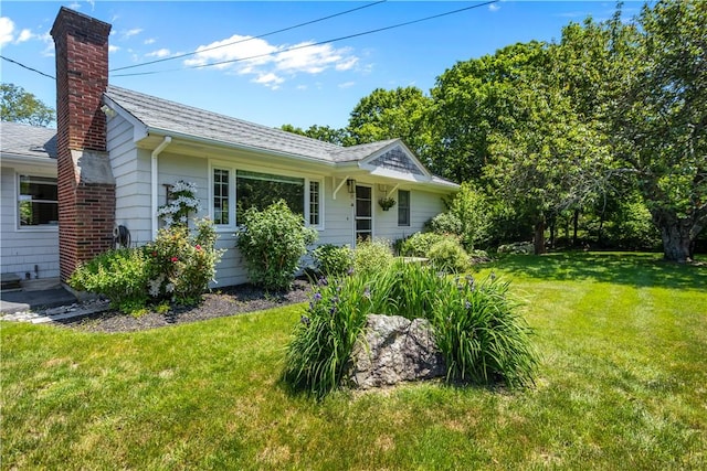386 Stone Church Rd, Tiverton, RI 02878 - view of property exterior featuring a chimney, a yard, and roof with shingles