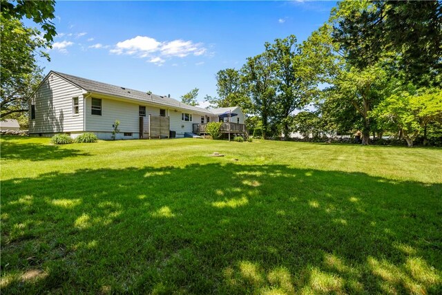 386 Stone Church Rd, Tiverton, RI 02878 - view of green lawn with a deck
