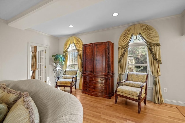 living area with recessed lighting, plenty of natural light, and light wood-style floors