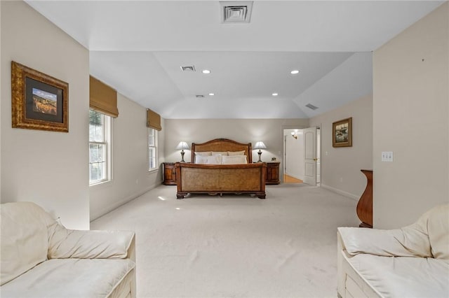bedroom featuring light colored carpet, baseboards, lofted ceiling, and visible vents