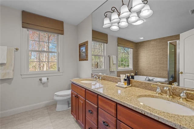 full bathroom featuring baseboards, a shower stall, a sink, and tile patterned floors
