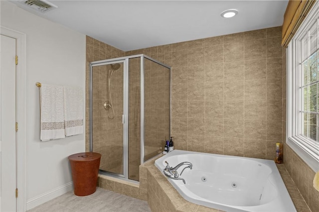 bathroom with a jetted tub, tile patterned flooring, a shower stall, and visible vents