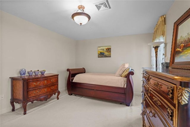 bedroom with baseboards, light colored carpet, and visible vents