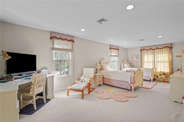 carpeted bedroom featuring recessed lighting, baseboards, and visible vents