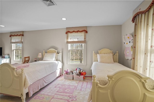 bedroom featuring visible vents, recessed lighting, and multiple windows
