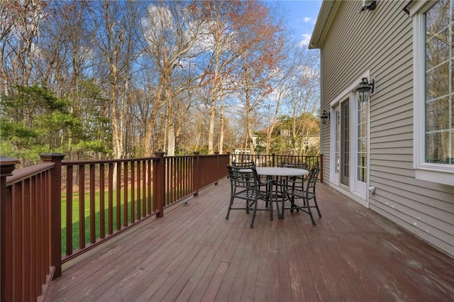 deck with outdoor dining area