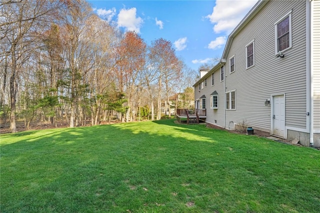 view of yard with a deck
