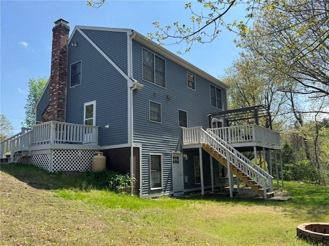 1 Gilman Rd, Hopkinton, RI 02832 - rear view of house featuring stairway, a deck, a chimney, a yard, and an outdoor fire pit