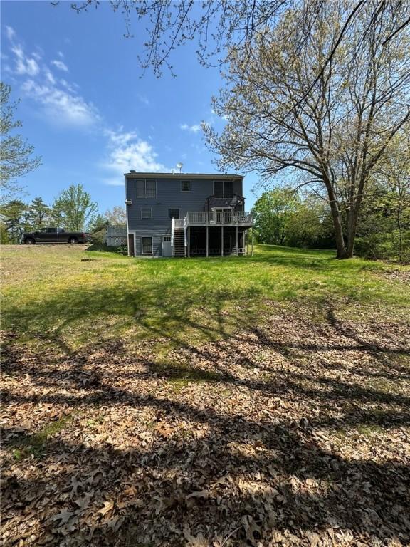 1 Gilman Rd, Hopkinton, RI 02832 - rear view of property featuring a deck and a lawn