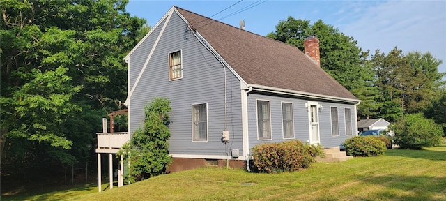 1 Gilman Rd, Hopkinton, RI 02832 - view of property exterior with a chimney, a yard, roof with shingles, and a wooden deck