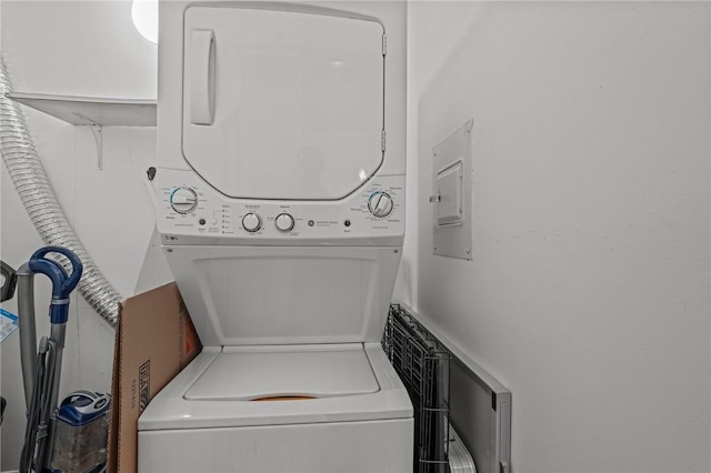laundry area with stacked washer / dryer