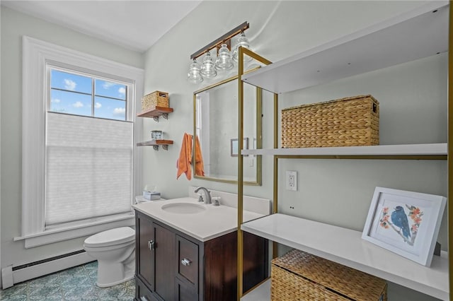 bathroom featuring baseboard heating, toilet, and vanity