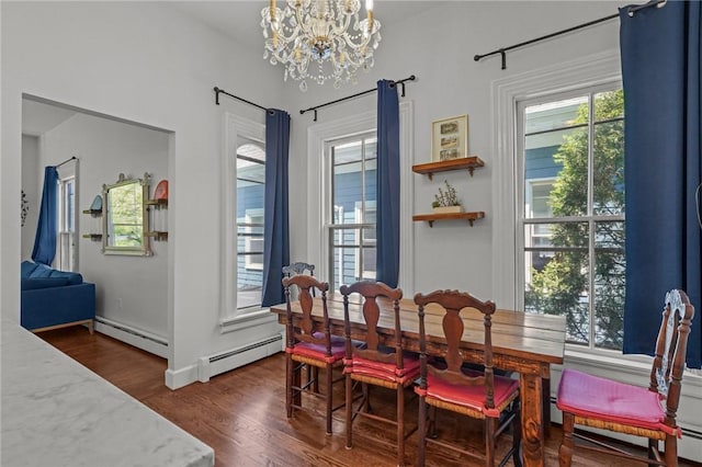dining space with a chandelier, dark wood finished floors, healthy amount of natural light, and a baseboard radiator