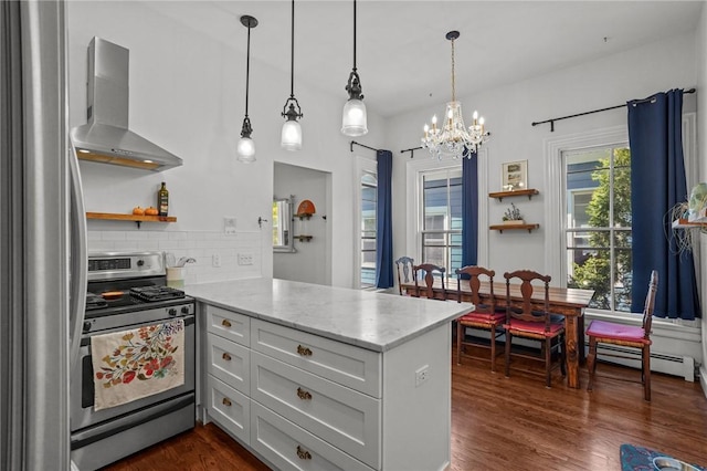 kitchen featuring appliances with stainless steel finishes, wall chimney range hood, a peninsula, open shelves, and a chandelier