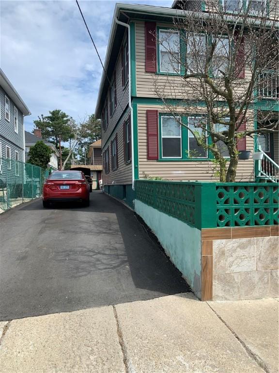 31 Ponagansett Ave, Providence, RI 02909 - view of side of home with aphalt driveway