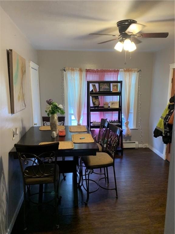 31 Ponagansett Ave, Providence, RI 02909 - dining room featuring baseboards, baseboard heating, a ceiling fan, and wood finished floors