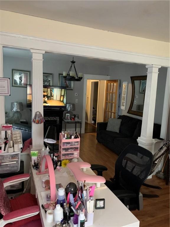 31 Ponagansett Ave, Providence, RI 02909 - living area featuring decorative columns and wood finished floors