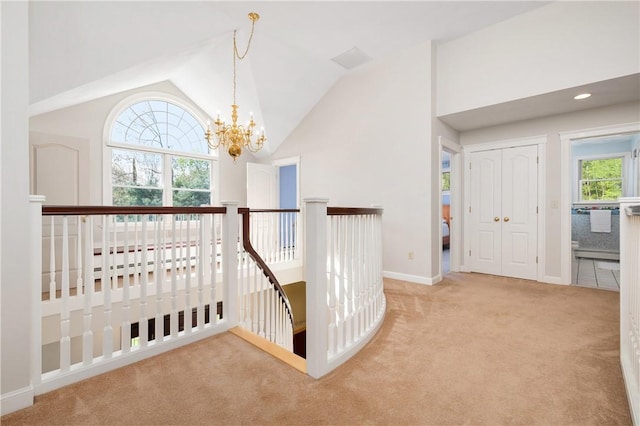 825 Woonsocket Hill Rd, North Smithfield, RI 02896 - interior space featuring carpet flooring, a chandelier, baseboards, an upstairs landing, and vaulted ceiling