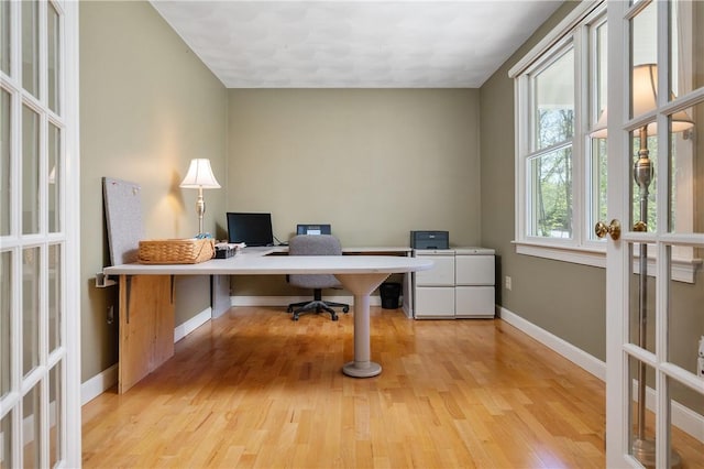 825 Woonsocket Hill Rd, North Smithfield, RI 02896 - home office with baseboards, french doors, and light wood-style floors