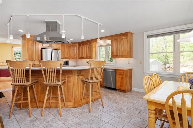 825 Woonsocket Hill Rd, North Smithfield, RI 02896 - kitchen featuring a kitchen bar, island range hood, appliances with stainless steel finishes, light countertops, and baseboards