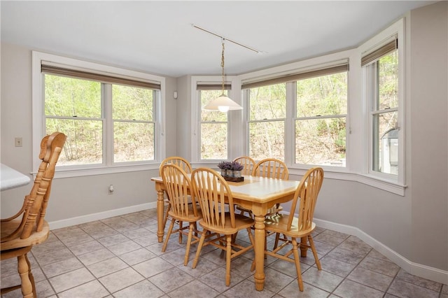 825 Woonsocket Hill Rd, North Smithfield, RI 02896 - dining area featuring light tile patterned flooring and baseboards