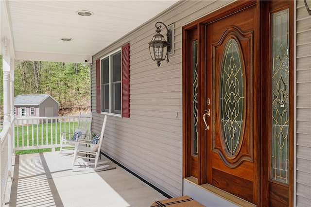 825 Woonsocket Hill Rd, North Smithfield, RI 02896 - view of exterior entry featuring covered porch