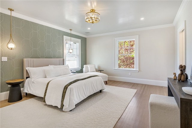 349 Wayland Ave, Providence, RI 02906 - bedroom featuring wallpapered walls, baseboards, a chandelier, wood finished floors, and crown molding