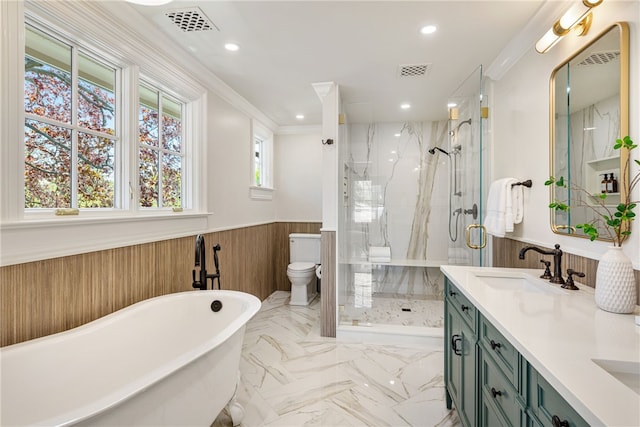 349 Wayland Ave, Providence, RI 02906 - bathroom featuring wainscoting, a marble finish shower, toilet, recessed lighting, and a freestanding tub