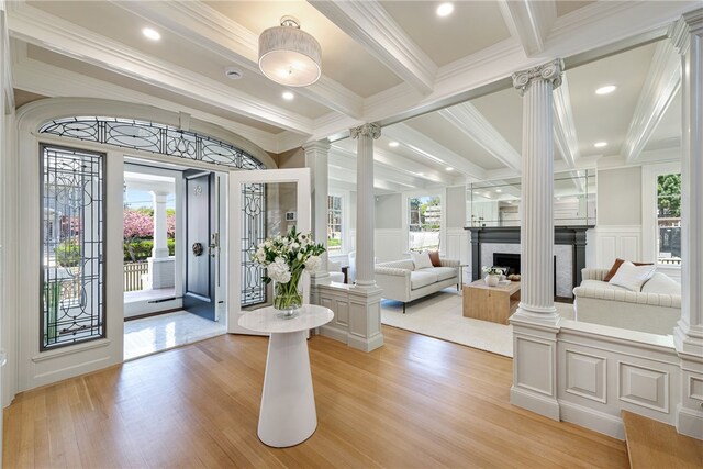 349 Wayland Ave, Providence, RI 02906 - entrance foyer with decorative columns, a decorative wall, light wood-type flooring, ornamental molding, and beam ceiling