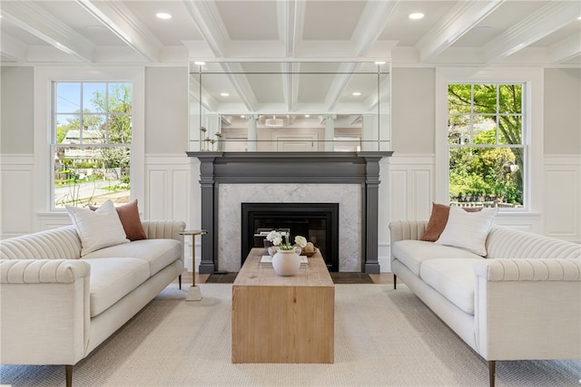 349 Wayland Ave, Providence, RI 02906 - living area featuring a decorative wall, beamed ceiling, crown molding, healthy amount of natural light, and a fireplace