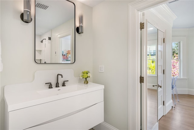 349 Wayland Ave, Providence, RI 02906 - bathroom featuring baseboards, vanity, and wood finished floors