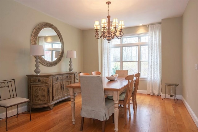 27 Tom Harvey Rd, Westerly, RI 02891 - dining room featuring a chandelier, plenty of natural light, baseboards, and light wood finished floors