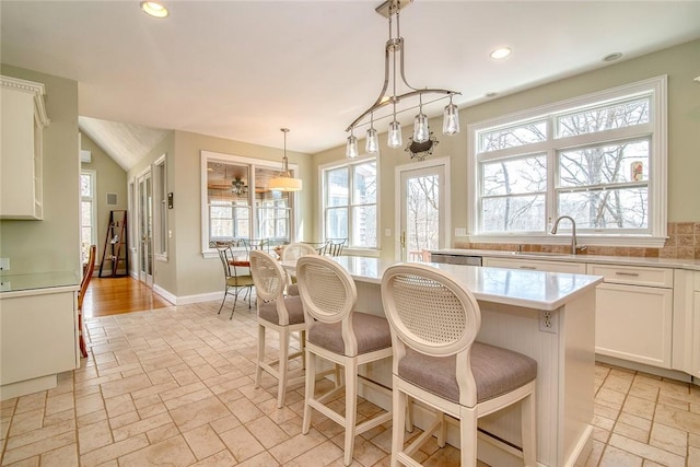 27 Tom Harvey Rd, Westerly, RI 02891 - kitchen featuring plenty of natural light, a breakfast bar, light countertops, and recessed lighting