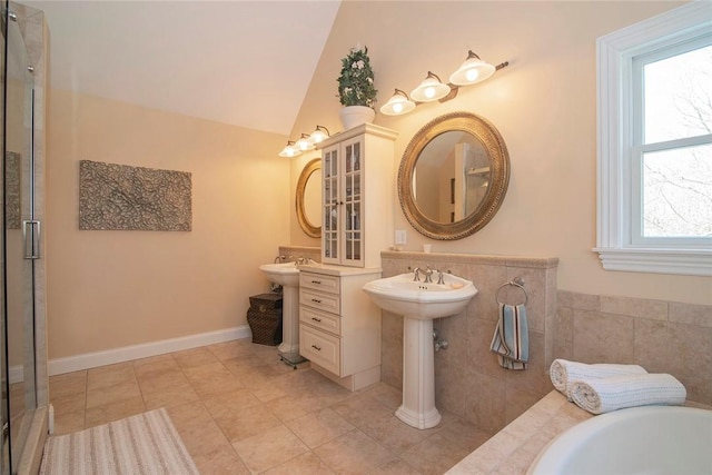 27 Tom Harvey Rd, Westerly, RI 02891 - bathroom featuring a bath, a shower stall, tile patterned flooring, and vaulted ceiling