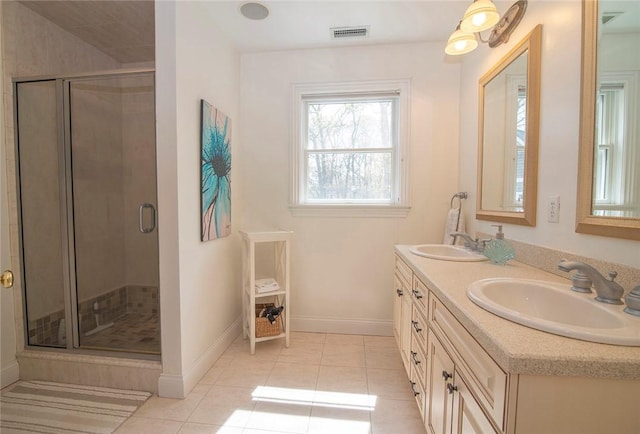 27 Tom Harvey Rd, Westerly, RI 02891 - bathroom with tile patterned floors, double vanity, and a stall shower