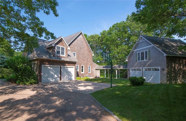 27 Tom Harvey Rd, Westerly, RI 02891 - view of side of property featuring driveway and a yard