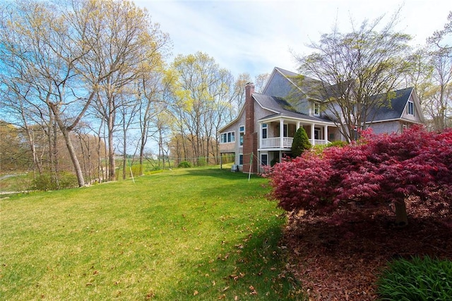 27 Tom Harvey Rd, Westerly, RI 02891 - view of side of home featuring a lawn and a chimney